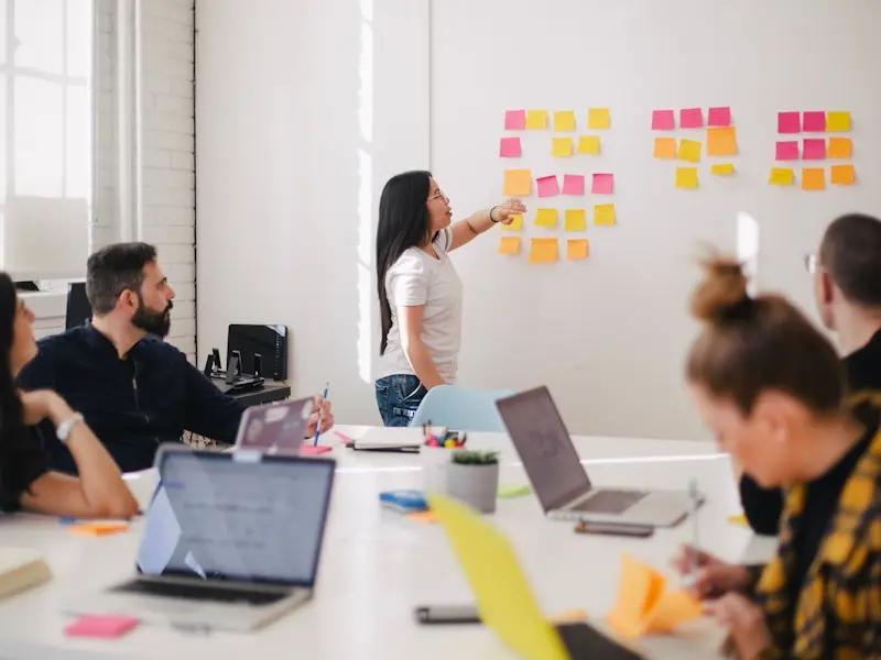 Content creation team brainstorming ideas and writing copy
